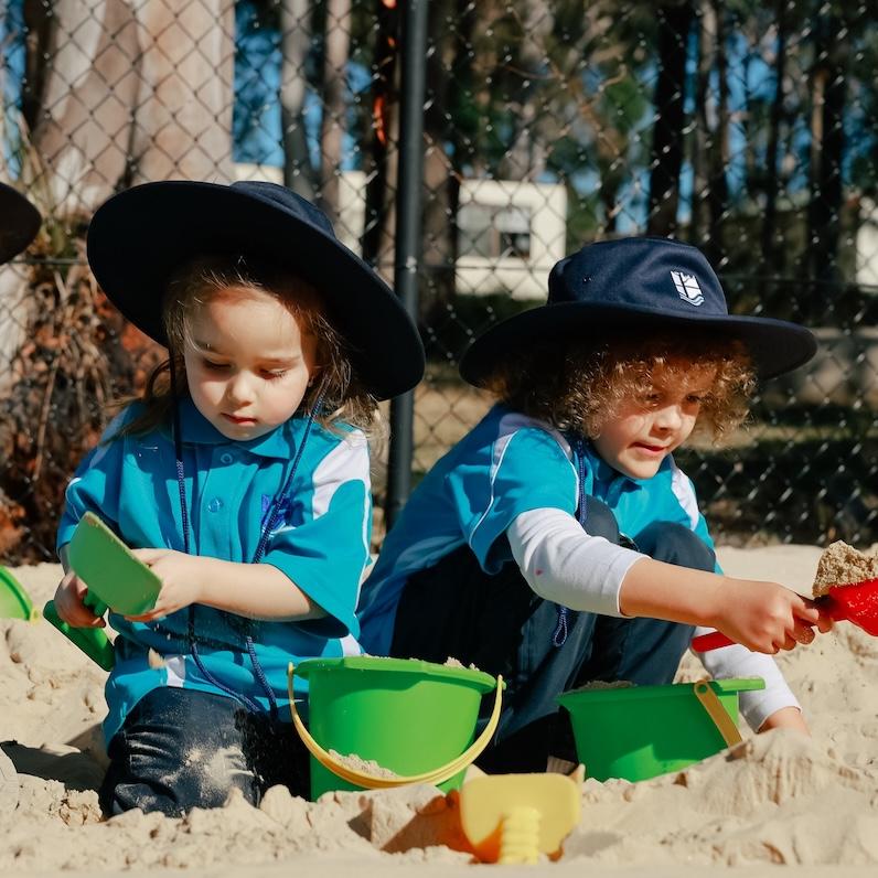 Group of prep students engaged in creative play in the sandpit at Medowie Christian School.