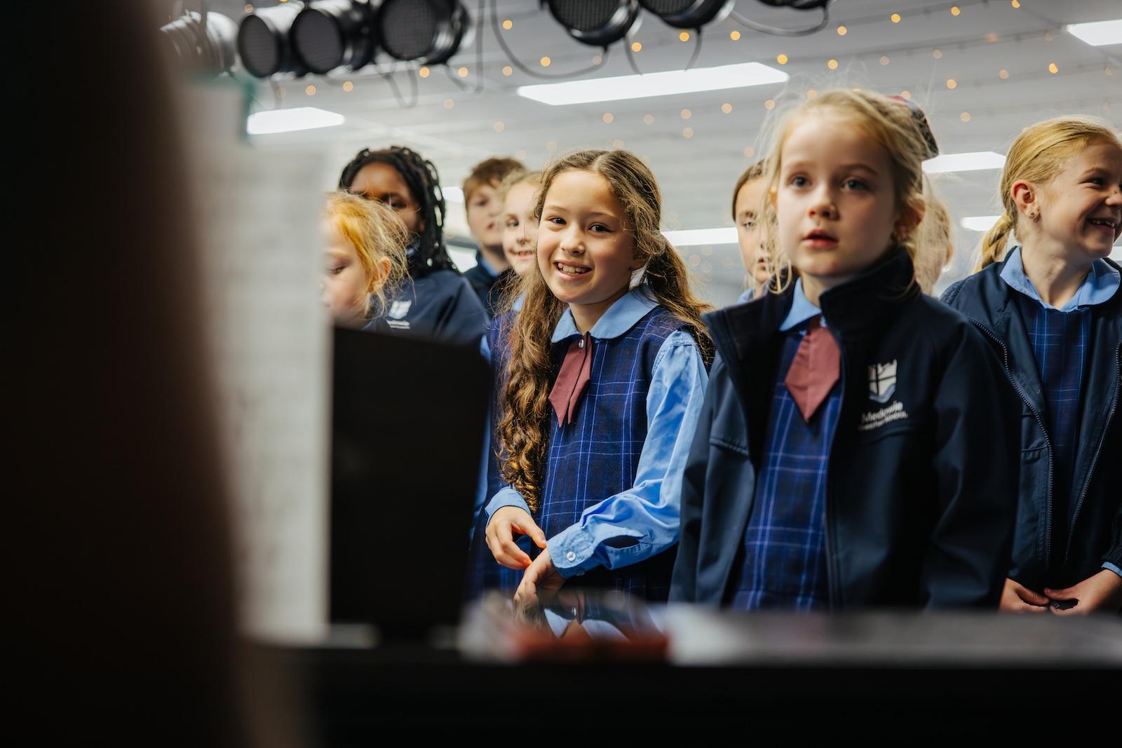 Primary students engaging in a choir practice session at Medowie Christian School, fostering creativity and teamwork.