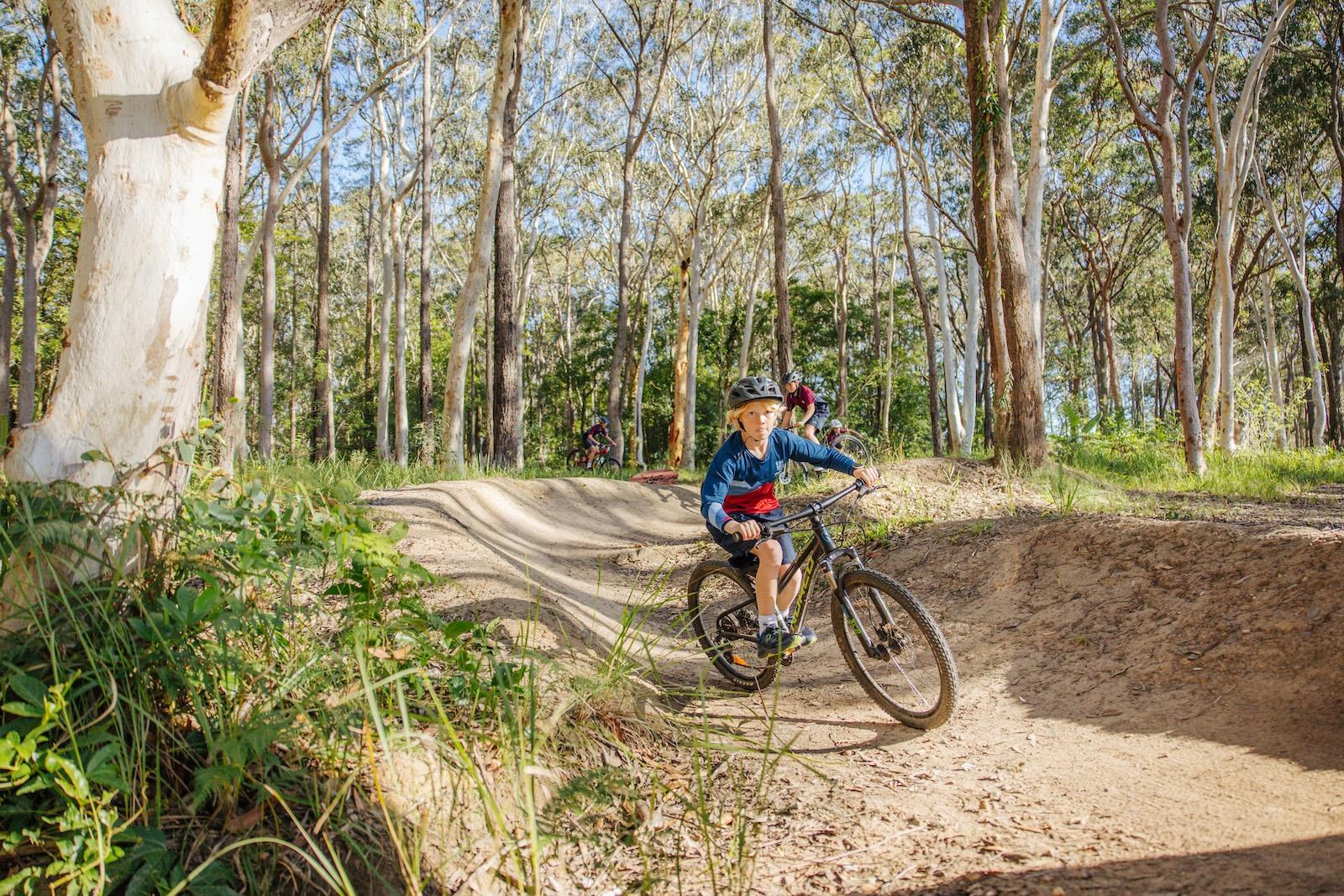 Primary student enjoying a mountain biking trail as part of outdoor activities at Medowie Christian School.