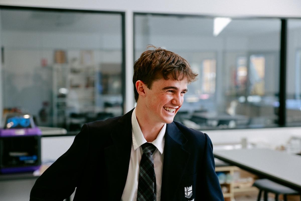 A smiling high school student at Medowie Christian School, highlighting a positive and supportive learning environment.