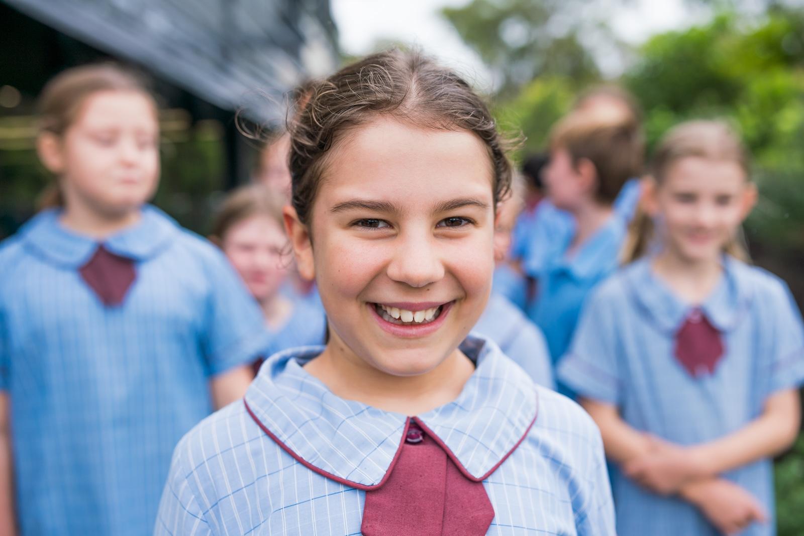 A smiling student at Medowie Christian School, embodying the joy and sense of community in the school.