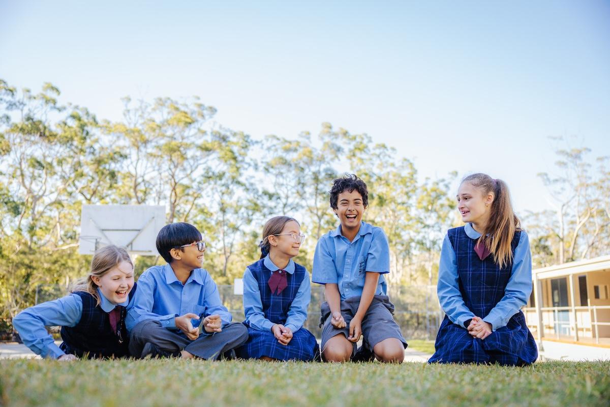 Group of students laughing together outdoors, reflecting the Christ-centred, inclusive community at Medowie Christian School.